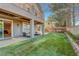 Lush backyard with covered patio, perfect for outdoor dining and entertaining at 9704 Royal Lamb Dr, Las Vegas, NV 89145
