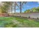 Spacious backyard featuring a well-manicured lawn and mature trees offering privacy at 9704 Royal Lamb Dr, Las Vegas, NV 89145