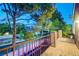 A cozy balcony overlooking a street with lush trees and manicured lawns creating a private retreat at 9704 Royal Lamb Dr, Las Vegas, NV 89145