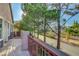 Balcony overlooking the neighborhood street with paved flooring and wrought iron safety railing at 9704 Royal Lamb Dr, Las Vegas, NV 89145