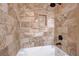 A close up of a tile shower with built in shelf and rainfall shower head at 9704 Royal Lamb Dr, Las Vegas, NV 89145