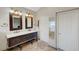Elegant bathroom featuring double sinks, designer mirrors, and neutral color palette at 9704 Royal Lamb Dr, Las Vegas, NV 89145