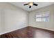 This is a bedroom with a ceiling fan and hardwood floors at 9704 Royal Lamb Dr, Las Vegas, NV 89145