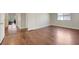 This bedroom features hardwood floors, natural light, and neutral paint at 9704 Royal Lamb Dr, Las Vegas, NV 89145