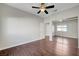 This is a bedroom featuring a ceiling fan and mirrored closet doors at 9704 Royal Lamb Dr, Las Vegas, NV 89145