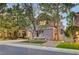 Two-story home with mature trees and manicured lawn at 9704 Royal Lamb Dr, Las Vegas, NV 89145