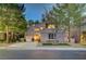 Charming two-story home with mature trees, manicured lawn and driveway at 9704 Royal Lamb Dr, Las Vegas, NV 89145