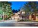 Charming two-story home featuring manicured landscaping, a well-lit driveway, and an inviting entrance at 9704 Royal Lamb Dr, Las Vegas, NV 89145