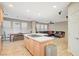 Open floor plan showcases the kitchen island, adjacent dining, and living areas at 9704 Royal Lamb Dr, Las Vegas, NV 89145