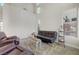 Cozy seating area with high ceilings, neutral paint, and plush rug for comfort at 9704 Royal Lamb Dr, Las Vegas, NV 89145