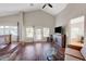 Living room featuring vaulted ceilings, hardwood floors, and access to outdoor space at 9704 Royal Lamb Dr, Las Vegas, NV 89145