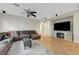 The living room features a large couch, hardwood floors, and mounted flat screen tv at 9704 Royal Lamb Dr, Las Vegas, NV 89145
