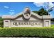 Elegant community signage features the Queensridge neighborhood with lush green landscaping at 9704 Royal Lamb Dr, Las Vegas, NV 89145