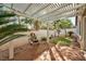 Backyard with a fountain and covered patio at 10017 Snow Crest Pl, Las Vegas, NV 89134