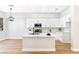 Contemporary kitchen equipped with white cabinetry and a central island, perfect for cooking and entertaining at 10017 Snow Crest Pl, Las Vegas, NV 89134