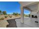 Inviting backyard with covered patio, desert landscaping, and scenic views, perfect for relaxation at 10100 Folsom Dr, Las Vegas, NV 89134