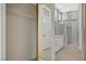 Bright bathroom featuring a large glass shower, white cabinets, and stylish modern fixtures at 10100 Folsom Dr, Las Vegas, NV 89134