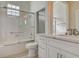 Well-lit bathroom featuring a tub-shower combination, modern fixtures, and stylish vanity with ample storage at 10100 Folsom Dr, Las Vegas, NV 89134