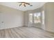 Bedroom featuring bay windows, sleek floors, and plenty of natural light at 10100 Folsom Dr, Las Vegas, NV 89134