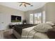 Bedroom with bay window and ceiling fan, virtually staged for entertainment at 10100 Folsom Dr, Las Vegas, NV 89134