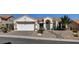 Charming single-story home featuring a well-maintained lawn and a two-car garage at 10100 Folsom Dr, Las Vegas, NV 89134