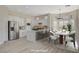 Staged open kitchen with marble island, stainless steel appliances, and a dining area perfect for Gathering gatherings at 10100 Folsom Dr, Las Vegas, NV 89134