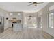 Bright, open kitchen featuring an island with marble countertop, stainless steel appliances and access to backyard at 10100 Folsom Dr, Las Vegas, NV 89134