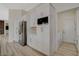 Modern kitchen with stainless steel appliances, white cabinetry, and light wood flooring at 10100 Folsom Dr, Las Vegas, NV 89134