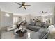 Spacious living room features a neutral color palette, plush seating, and ample natural light at 10100 Folsom Dr, Las Vegas, NV 89134