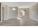 Bright living room with sleek flooring, ample natural light, and modern lighting fixture showcasing an open and inviting space at 10100 Folsom Dr, Las Vegas, NV 89134
