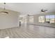 Bright and airy living room with light wood floors, recessed lighting, and large windows at 10100 Folsom Dr, Las Vegas, NV 89134