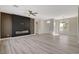 The bright living room features luxury vinyl plank flooring and a fireplace accent wall at 10100 Folsom Dr, Las Vegas, NV 89134
