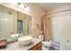 Well-lit bathroom featuring a vessel sink, granite counters, and a shower-tub combo at 10109 Jacob Pl # 203, Las Vegas, NV 89144