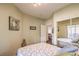 The bedroom includes mirrored closet doors and a calming color scheme at 10109 Jacob Pl # 203, Las Vegas, NV 89144