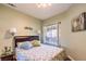 This well-lit bedroom offers a comfortable retreat with a cozy bed and calming wall color at 10109 Jacob Pl # 203, Las Vegas, NV 89144