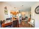 Open concept design featuring a dining area with a marble table set, seamlessly connected to the kitchen and living room at 10109 Jacob Pl # 203, Las Vegas, NV 89144