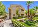Two story condo exterior with desert landscaping, stairs and balcony at 10109 Jacob Pl # 203, Las Vegas, NV 89144