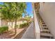 Exterior view of a condominium building with well-maintained landscaping and easy access to stairways at 10109 Jacob Pl # 203, Las Vegas, NV 89144