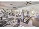 Spacious gym offers a range of workout equipment, including weight machines, treadmills, and free weights at 10109 Jacob Pl # 203, Las Vegas, NV 89144