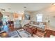 Inviting living room and dining area, featuring a comfortable sofa, dining table, and hardwood floors at 10109 Jacob Pl # 203, Las Vegas, NV 89144
