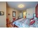 The primary suite includes hardwood floors, soft wall tones, and an ensuite bathroom for added privacy at 10109 Jacob Pl # 203, Las Vegas, NV 89144