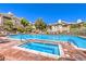 Community pool with inviting blue water and lounge chairs, surrounded by well-maintained landscaping at 10109 Jacob Pl # 203, Las Vegas, NV 89144