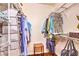 Spacious walk-in closet provides ample storage with metal shelving and hanging racks for organized wardrobe solutions at 10109 Jacob Pl # 203, Las Vegas, NV 89144