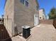 Low-maintenance backyard, door leading to the home's interior at 10230 Viterbo St, Las Vegas, NV 89183