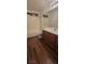 Bathroom features wood-look floors, a large mirror, and a tub and shower combination at 10230 Viterbo St, Las Vegas, NV 89183