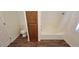 Full bathroom featuring a shower-tub combination, wood-look floors, and extra storage at 10230 Viterbo St, Las Vegas, NV 89183
