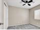 Bedroom with ceiling fan, carpet flooring, and window allowing natural light at 10230 Viterbo St, Las Vegas, NV 89183