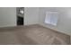 Spacious bedroom boasts neutral tones and plush carpet, offering serene retreat at 10230 Viterbo St, Las Vegas, NV 89183