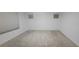 Bedroom featuring plush carpeting, white walls, and ample natural light streaming through the window at 10230 Viterbo St, Las Vegas, NV 89183