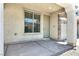 A front porch and door featuring stone detail on the entryway at 10230 Viterbo St, Las Vegas, NV 89183